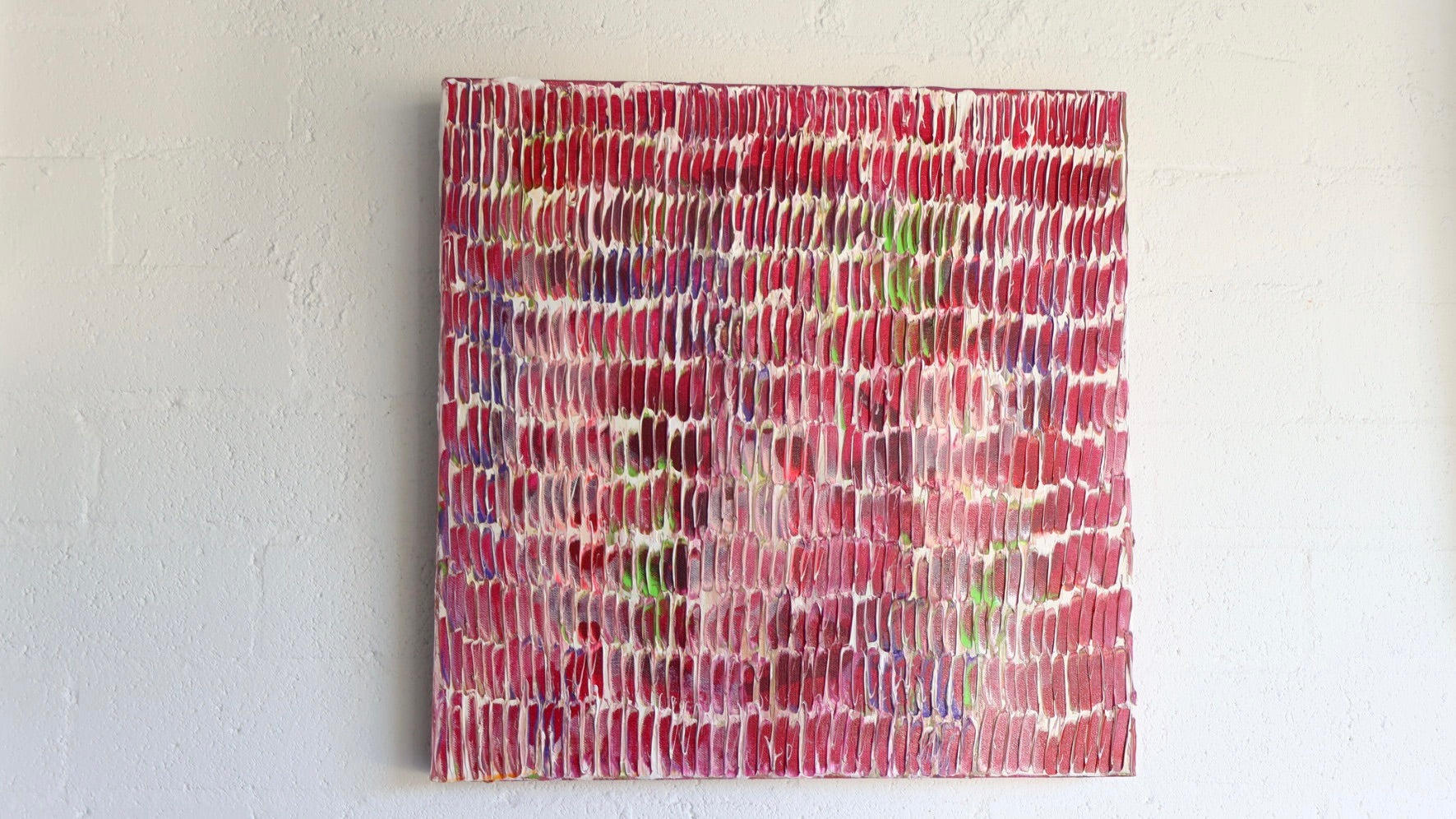 Abstract textured painting on a white wall